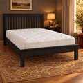 Shadow Wooden Bed Frame in black with a mattress, in a cosy bedroom