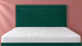 Dallas Headboard in Plush Velvet Emerald, close-up against a dusky rose wall
