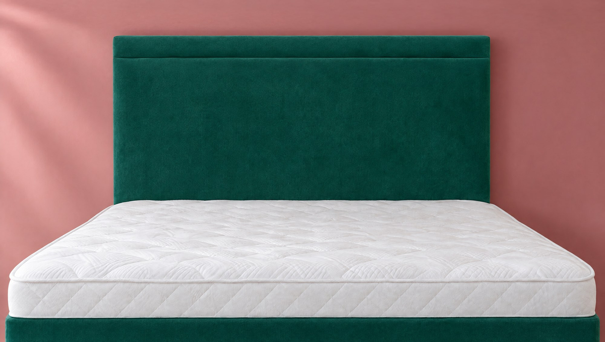 Dallas Headboard in Plush Velvet Emerald, close-up against a dusky rose wall